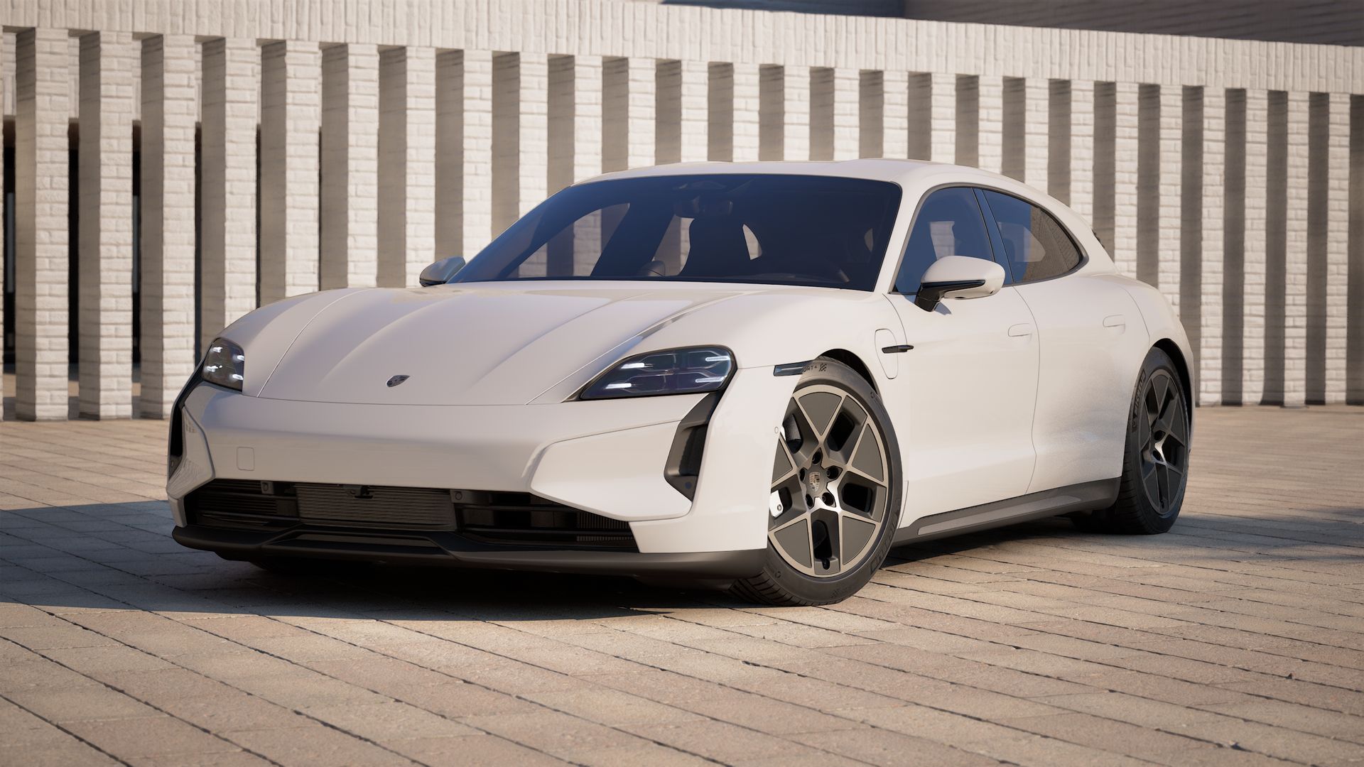Außenansicht von Taycan Turbo Sport Turismo mit der Vorderseite und der linken Seite des Fahrzeugs