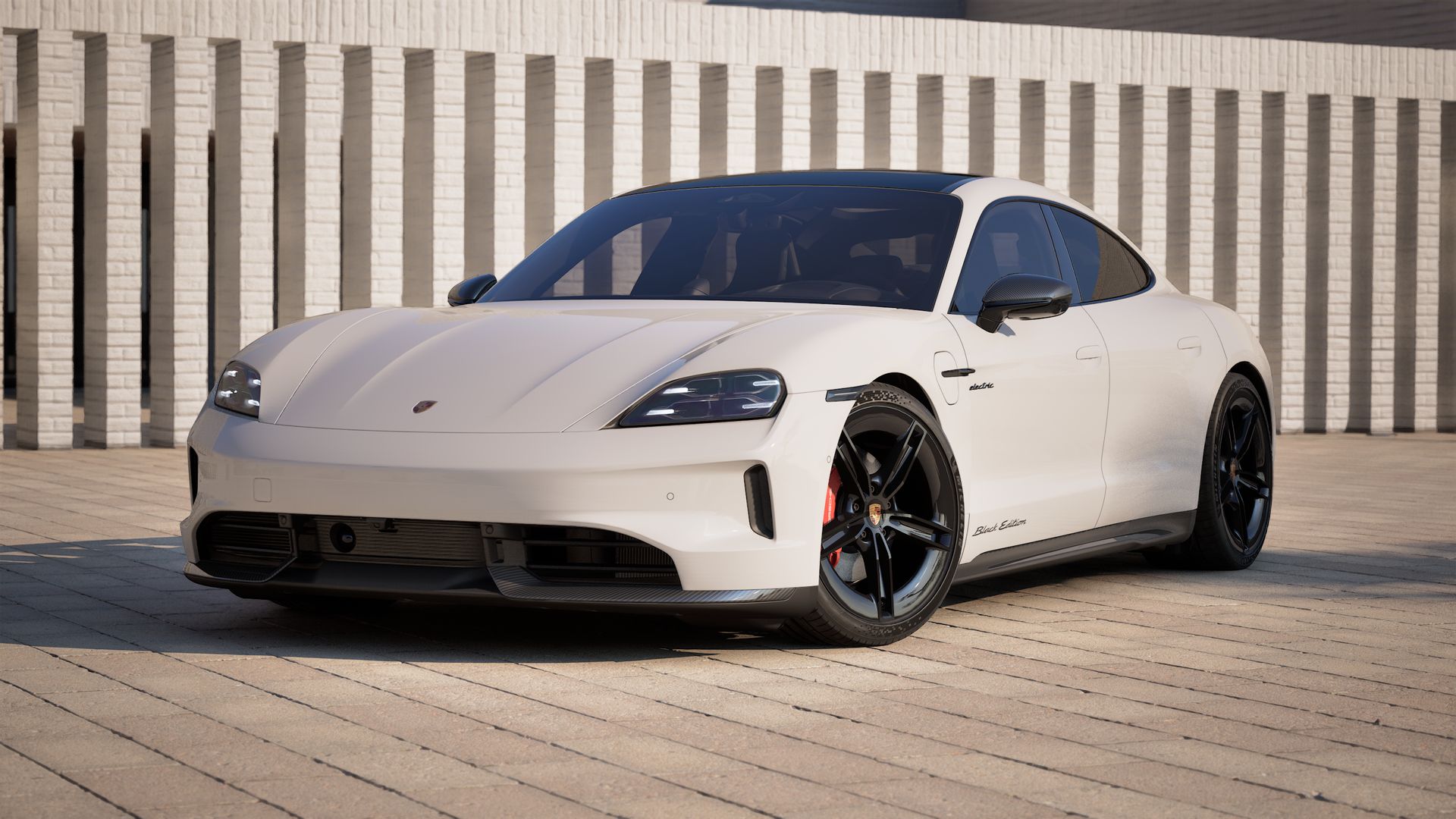 Vue extérieure de Taycan 4S Black Edition montrant l'avant et le côté gauche de la voiture