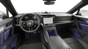 Vista interior que muestra el volante y el tablero de Cayenne S Coupé Electric