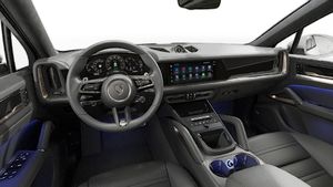 Interior view showing the steering wheel and dashboard of Cayenne Turbo E-Hybrid Coupé