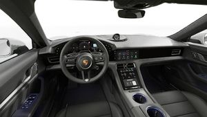 Interior view showing the steering wheel and dashboard of Taycan