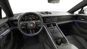Interior view showing the steering wheel and dashboard of Panamera 4 E-Hybrid