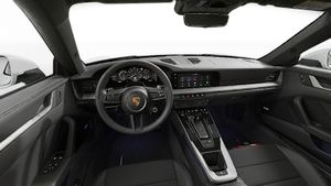 Interior view showing the steering wheel and dashboard of 911 Carrera 4S