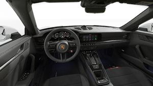 Interior view showing the steering wheel and dashboard of 911 Carrera 4 GTS Cabriolet