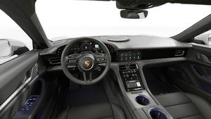 Interior view showing the steering wheel and dashboard of Taycan 4S