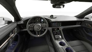 Interior view showing the steering wheel and dashboard of Taycan Turbo S