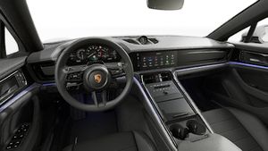 Interior view showing the steering wheel and dashboard of Panamera 4 E-Hybrid