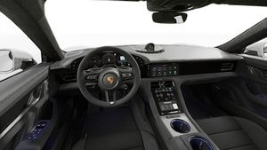 Vista interior mostrando o volante e o painel de instrumentos de Taycan GTS (2027)