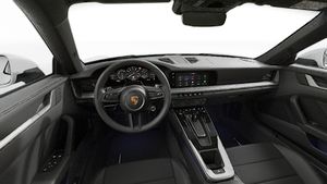 Interior view showing the steering wheel and dashboard of 911 Carrera