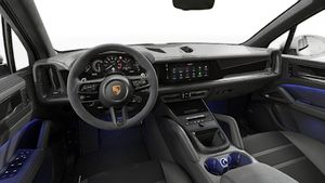 Interior view showing the steering wheel and dashboard of Cayenne GTS