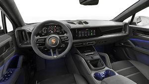 Interior view showing the steering wheel and dashboard of Cayenne GTS Coupé