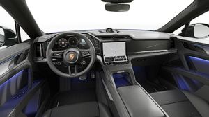 Interior view showing the steering wheel and dashboard of Cayenne Coupé Electric