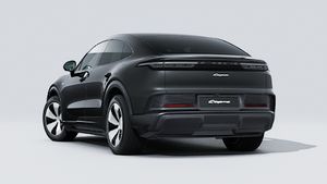 Exterior view of Cayenne Coupé Electric showing the back and left side of the car