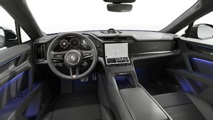 Interior view showing the steering wheel and dashboard of Cayenne Turbo Coupé Electric