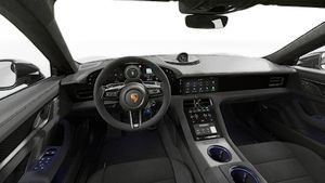 Interior view showing the steering wheel and dashboard of Taycan Turbo GT