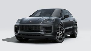 Vista esterna di Cayenne E-Hybrid Coupé Black Edition che mostra la parte anteriore e il lato sinistro della vettura