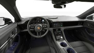 Vista interna che mostra il volante e il cruscotto di Taycan Sport Turismo Black Edition