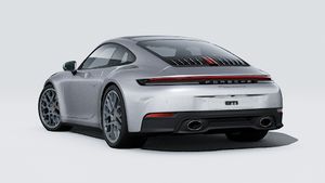 Vista exterior de 911 Carrera 4S mostrando la parte trasera y el lado izquierdo del coche