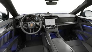 Vista interior que muestra el volante y el salpicadero de Cayenne Coupé Electric