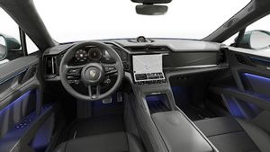 Vista interior que muestra el volante y el salpicadero de Cayenne Turbo Coupé Electric