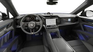 Vista interior que muestra el volante y el salpicadero de Cayenne Turbo Electric