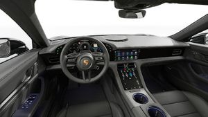 Vista interior que muestra el volante y el salpicadero de Taycan 4 Black Edition