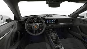 Interior view showing the steering wheel and dashboard of 911 Carrera GTS