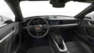 Interior view showing the steering wheel and dashboard of 911 Carrera