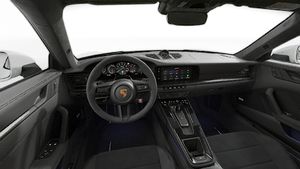 Interior view showing the steering wheel and dashboard of 911 Carrera 4 GTS