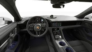 Interior view showing the steering wheel and dashboard of Taycan GTS
