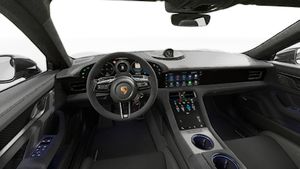 Interior view showing the steering wheel and dashboard of Taycan Turbo GT