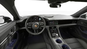Interior view showing the steering wheel and dashboard of Taycan Black Edition