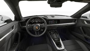 Interior view showing the steering wheel and dashboard of 911 Carrera 4S