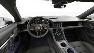 Interior view showing the steering wheel and dashboard of Taycan