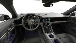 Interior view showing the steering wheel and dashboard of Taycan Black Edition