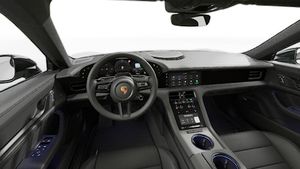 Interior view showing the steering wheel and dashboard of Taycan Sport Turismo Black Edition