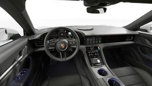 Interiørvisning, der viser rattet og instrumentbrættet på Taycan Sport Turismo