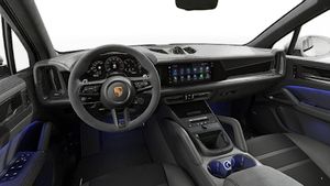 Interior view showing the steering wheel and dashboard of Cayenne GTS