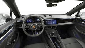 Interior view showing the steering wheel and dashboard of Macan 4S