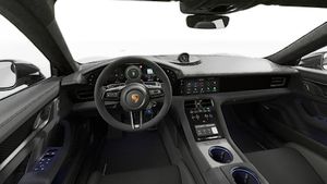 Interior view showing the steering wheel and dashboard of Taycan Turbo GT