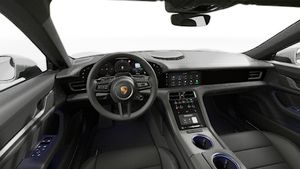 Sisäkuva, jossa näkyy ohjauspyörä ja kojelauta. Taycan Sport Turismo