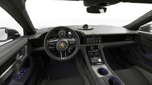 Vue de l'intérieur montrant le volant et le tableau de bord d'un véhicule de transport de marchandises. Taycan Turbo GT
