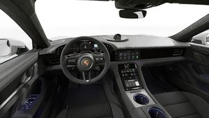 Vue de l'intérieur montrant le volant et le tableau de bord d'un véhicule de transport de marchandises. Taycan GTS Sport Turismo