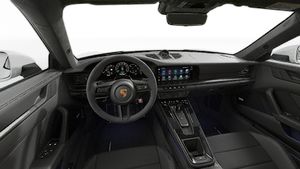Interior view showing the steering wheel and dashboard of 911 Carrera GTS