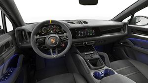 Interior view showing the steering wheel and dashboard of Cayenne Turbo E-Hybrid Coupé with GT Package