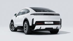 Exterior view of Cayenne Turbo Coupé Electric showing the back and left side of the car