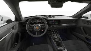 Interior view showing the steering wheel and dashboard of 911 Carrera GTS