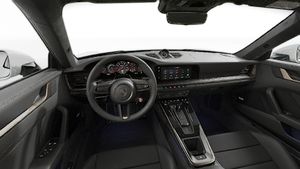 Interior view showing the steering wheel and dashboard of 911 Turbo S