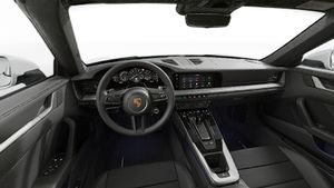 Interior view showing the steering wheel and dashboard of 911 Targa 4S