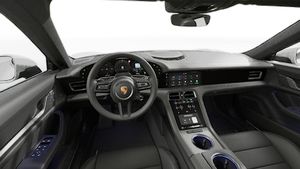 Interior view showing the steering wheel and dashboard of Taycan 4S
